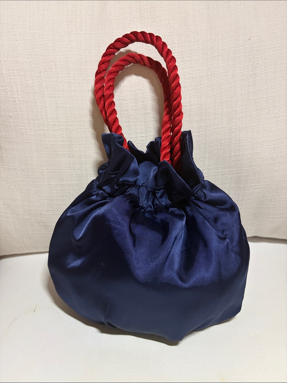 STAUD Navy Satin Mini Drawstring Bag with Red Rope Handles